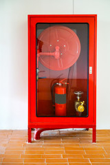 Fire Hose Cabinet on orange bricks floor