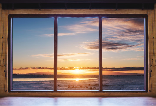 Fototapeta Looking through window in the morning sunrise, wooden window frame with desk