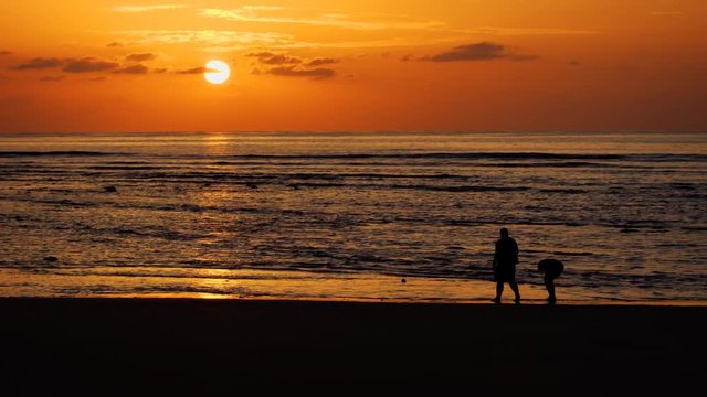 Couple Strolling along Phuket Tropical Beach at Sunset. 4k footage 2160p
