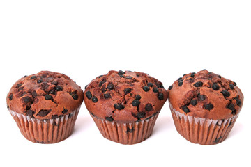 Muffin chocolate chip cup cake or cupcake in a row line isolated on white background photo