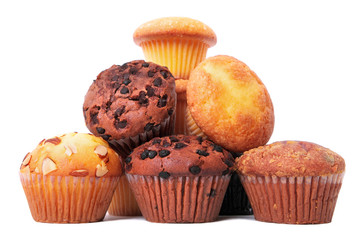 Muffin chocolate chip cup cake or cupcake various flavor several lots many pile heap isolated on white background photo