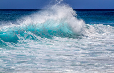 Aqua blue wave on the west side of Oahu Hawaii