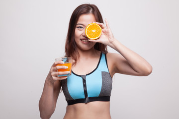 Beautiful Asian healthy girl with orange juice and orange fruit.