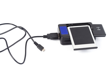 Multi function mobile usb charger on white background.