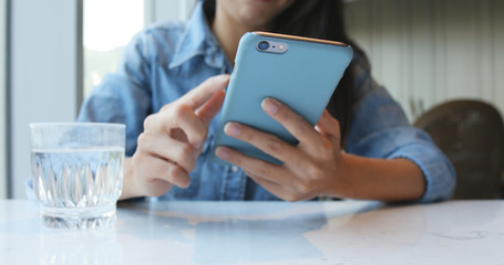 Woman use of cellphone in restaurant
