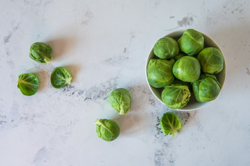 Fresh Brussels sprouts in a white bowl
