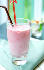 glass of smoothie with straw