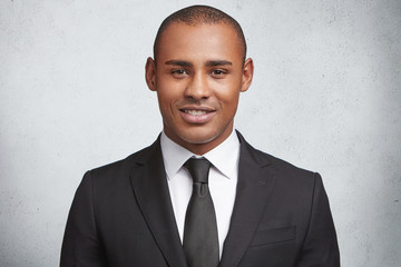 Successful prosperous businessman dressed formally, has good mood after signing profitable...