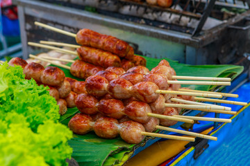 The pork sausage, fast food on the footpath.