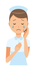 A woman nurse wearing a nurse cap and white coat is crying