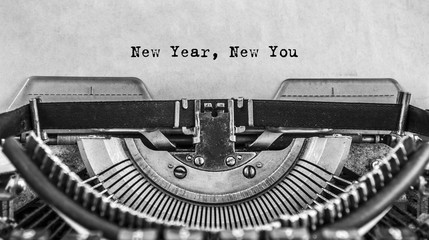 New Year New You message typed on old vintage typewriter. Cloce up