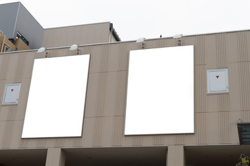 Large blank billboard on a street wall, banners with room to add your own text