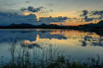 Beautiful sunset on  lake in the hill.