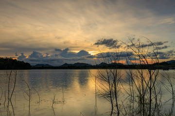Beautiful sunset on  lake in the hill.