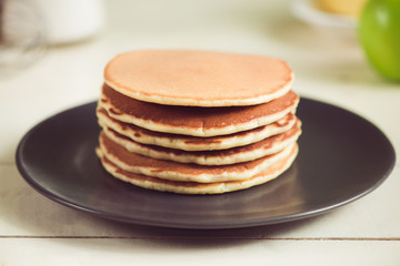 Pancakes with apple on table. Breakfast, snacks. Pancakes Day.