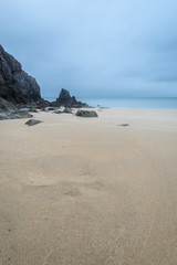 Stunning, vibrant sunrise landscape image of Barafundle Bay on Pembrokeshire Coast in Wales