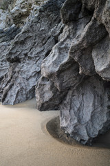 Intimate landscape image of rocks and sand on Broadhaven beach in Pembrokeshire Wales