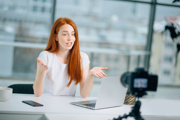 Female Vlogger Recording Broadcast At Home with laptop