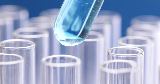 Scientist doing experiment with test tube