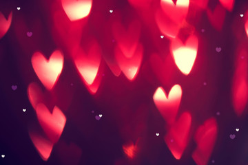 Valentine's Day background. Holiday abstract background with red glowing hearts