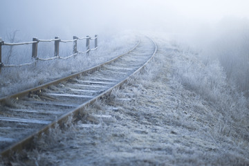 Winter landscape. Railway on a frosty morning.