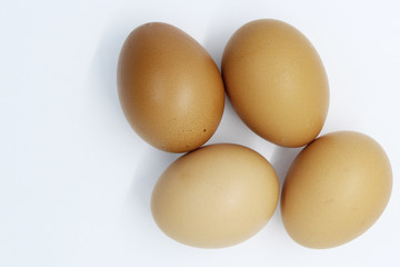 Close-up view of organic Brown Eggs on Plastic Egg Carton isolated on white background
