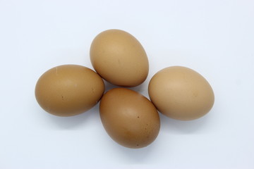 Close-up view of organic Brown Eggs on Plastic Egg Carton isolated on white background