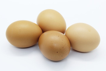 Close-up view of organic Brown Eggs on Plastic Egg Carton isolated on white background