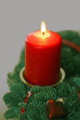 burning red candle on Advent wreath