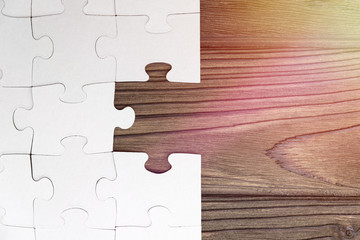 puzzles on the background of a wooden table