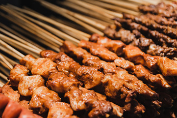 Chinese street food. fried chicken on stick