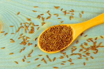 Cumin on the wooden background. Close Up.