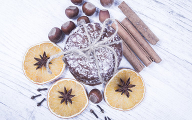 Gingerbread cookies, cinnamon and orange slices. Christmas decoration.