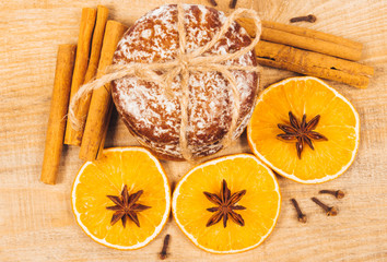 Gingerbread cookies, cinnamon and orange slices. Christmas decoration.