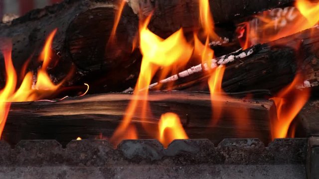 Open fire in iron barbecue stove