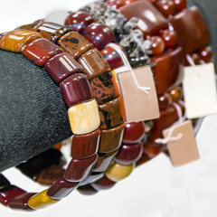 Women's bracelets from semiprecious stones. Showcase in the shop
