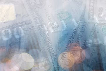 Double exposure of city and graph on rows of coins for finance and banking concept