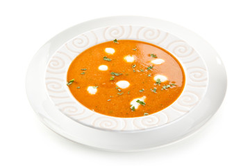 Tomato soup with cream on white background 