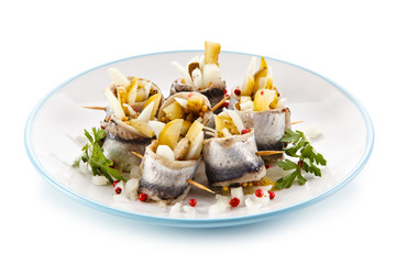 Marinated herring fillets on white background 