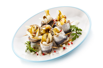Marinated herring fillets on white background 