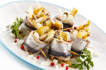 Marinated herring fillets on white background 