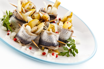 Marinated herring fillets on white background 
