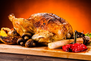 Roast chicken on cutting board 