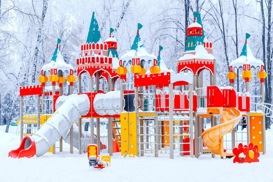 Theme kid park playground in snowy forest. Fairy tale background.
