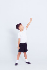 Fototapeta na wymiar Little cute child boy in white dance form at white background