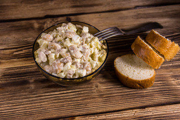 Salad with white kidney beans, potatoes, chicken meat, eggs and mayonnaise