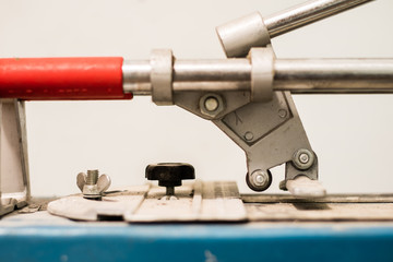 Tiling, tile trimming, metering and cutting. Repair of the floor. Sliced gres tiles.