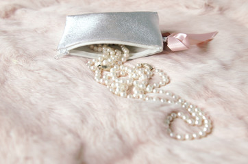 elegant pearl necklace on pink fur