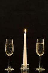 Outline of glasses of champagne and the candle