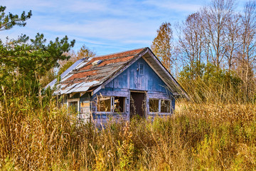 Abandoned Urban House in Field